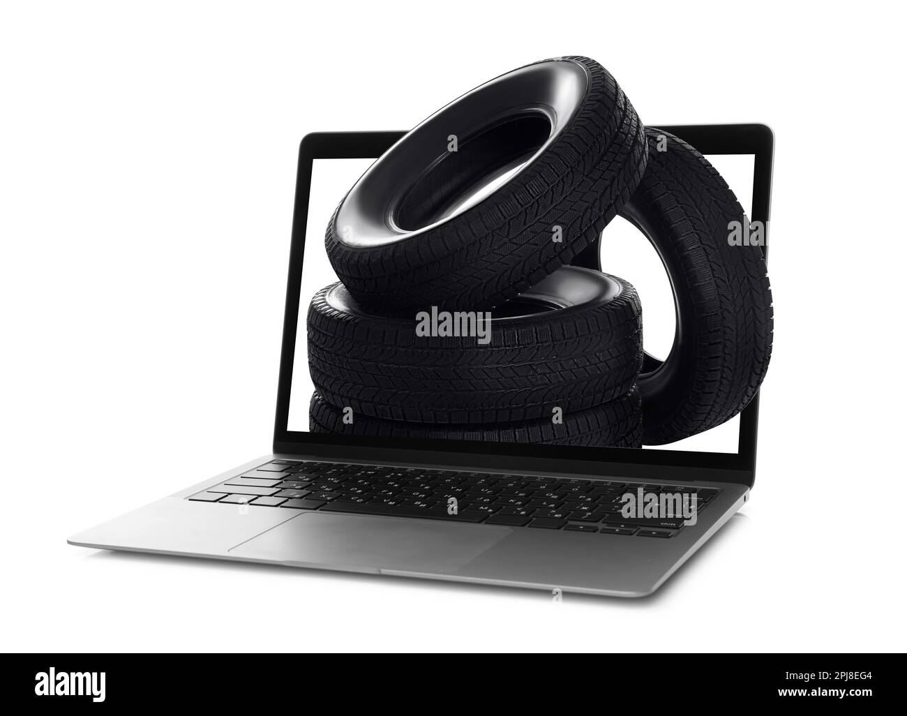 Online auto store, delivery service. Modern laptop and car tires on