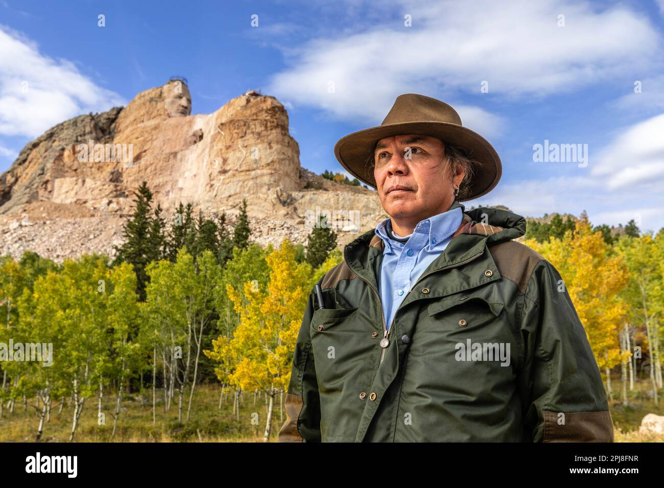 Lakota Sioux Native American posing in front of Crazy Horse Memorial, Black Hills, South Dakota, United States of America Stock Photo