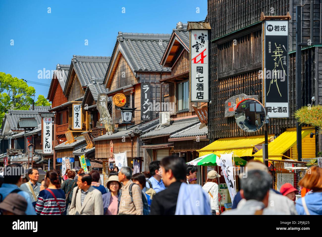 ISE, JAPAN - APRIL 25, 2014: Crowds walk on the historic shopping street of Oharai-machi. The reconstructed buildings are completed in the Edo period Stock Photo