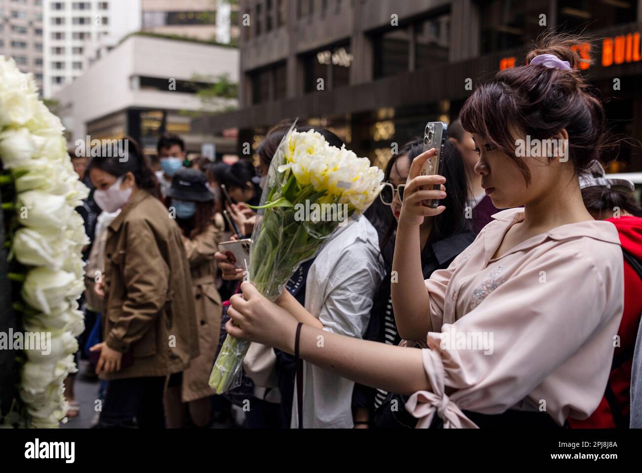 Fans visit outside the Mandarin Oriental Hotel to commemorate the 20th