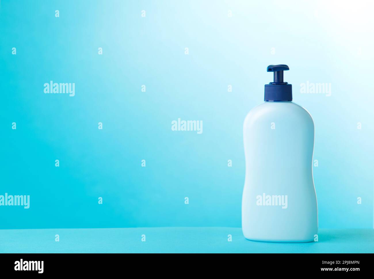 Blue tube of cosmetic on blue background, cut out Stock Photo