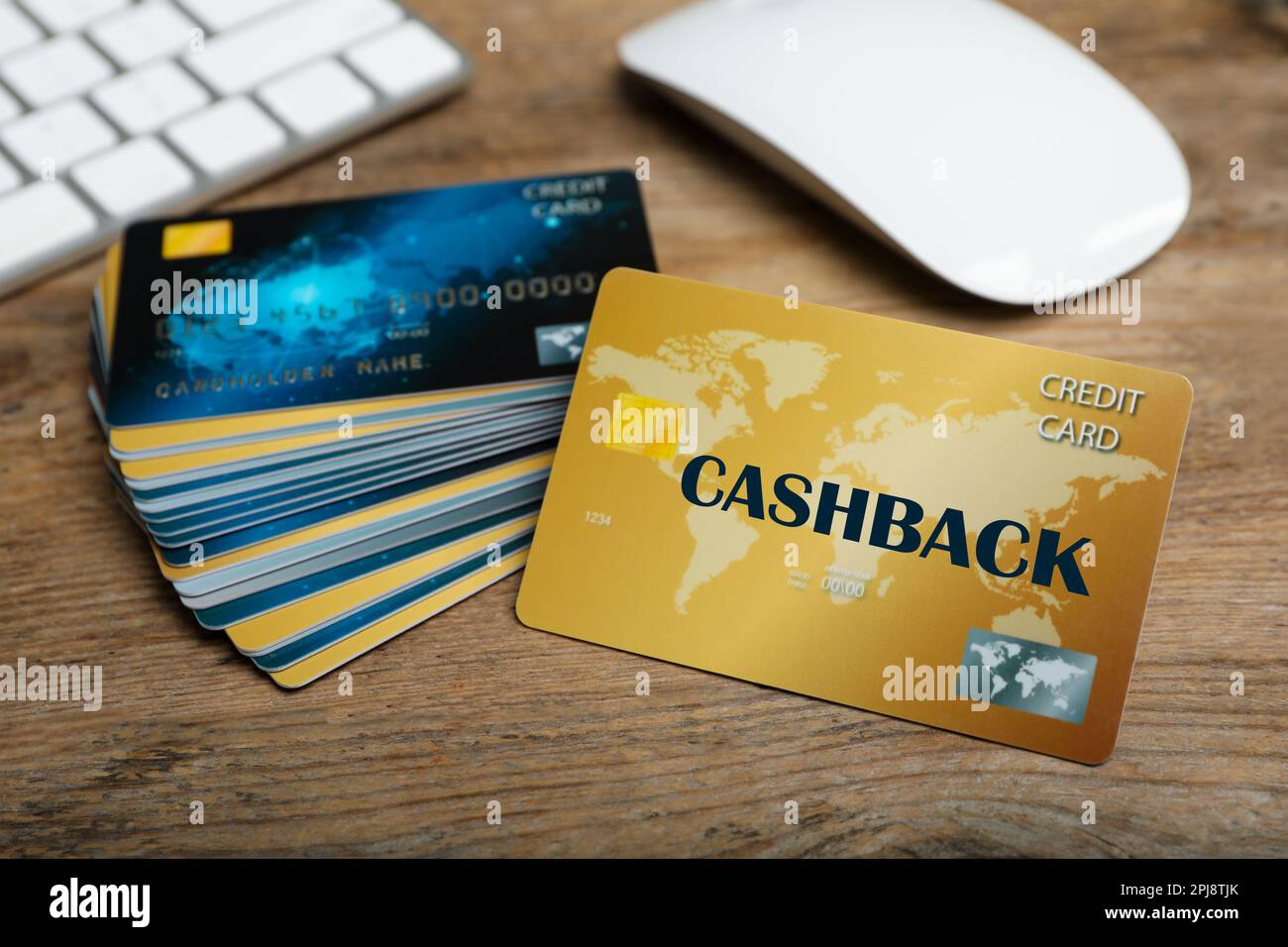 Cashback and credit cards on wooden table, closeup view Stock Photo