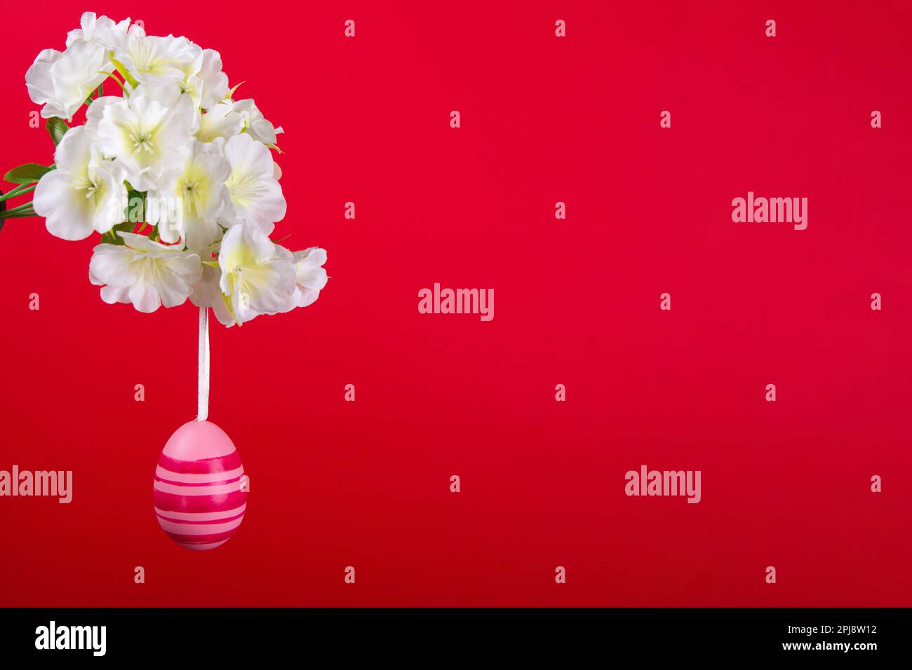Celebrate Easter with this stunning image featuring pink egg hanging