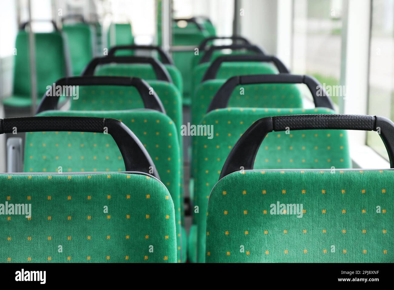 Rows of comfortable green seats in public transport Stock Photo Alamy