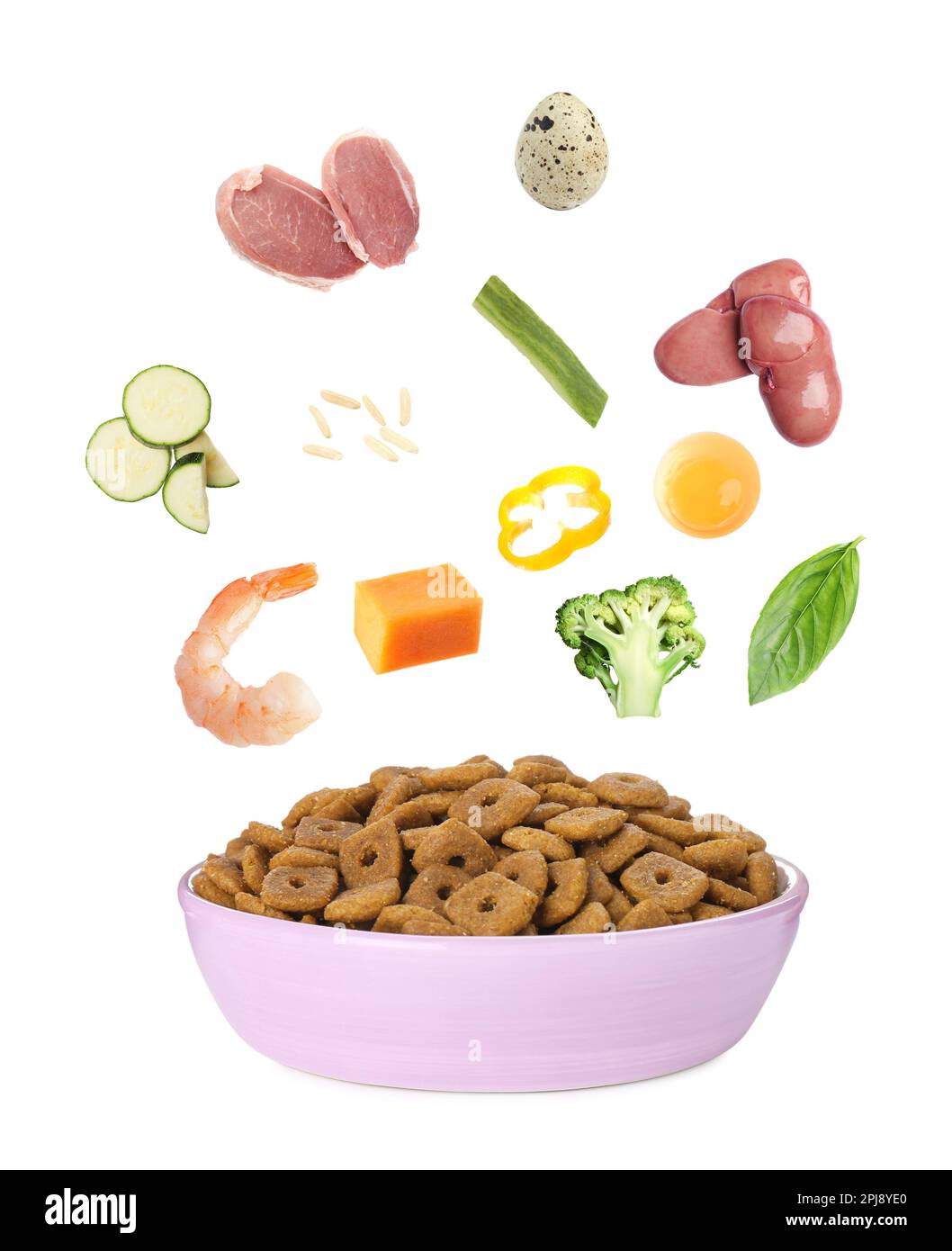 Natural organic ingredients and pet food in bowl on white background Stock Photo