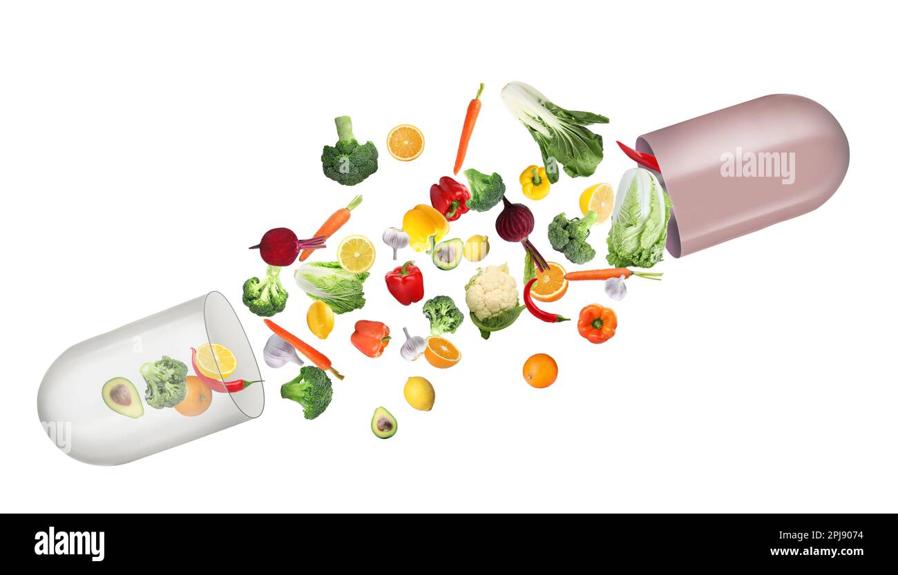 Dietary supplements. Capsule and different fresh vegetables and fruits flying on white background Stock Photo