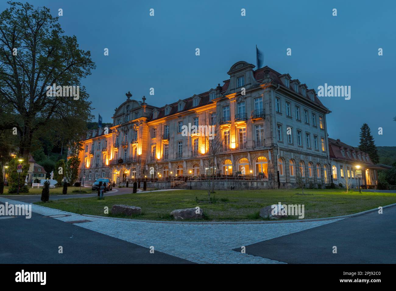 Art nouveaux Park Hotel at night in Kurpark in State Spa, Staatsbad Bruckenau, spa, wellness complex in Sinn Valley by Rhon Mountains. Bad Brackenau. Stock Photo