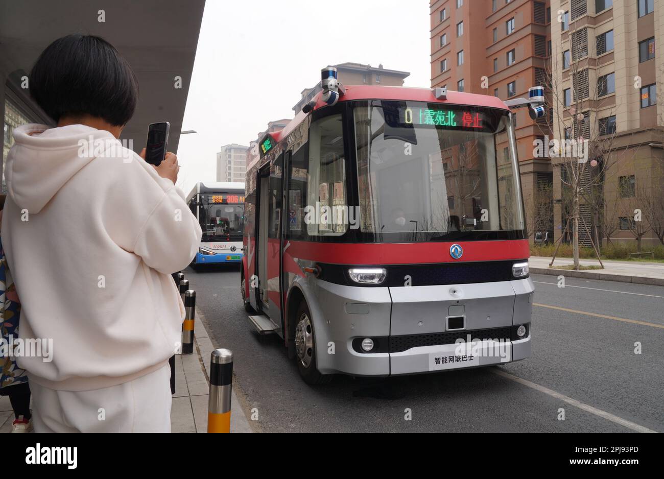 Shijiazhuang, China's Hebei Province. 20th Mar, 2023. An intelligent connected bus is seen in a trial operation on a street in Rongdong area of Xiong'an New Area, north China's Hebei Province, March 20, 2023. Credit: Mu Yu/Xinhua/Alamy Live News Stock Photo