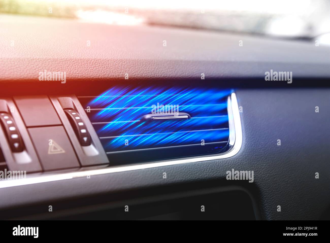 Cool stream of air from a car air conditioner on a hot summer day