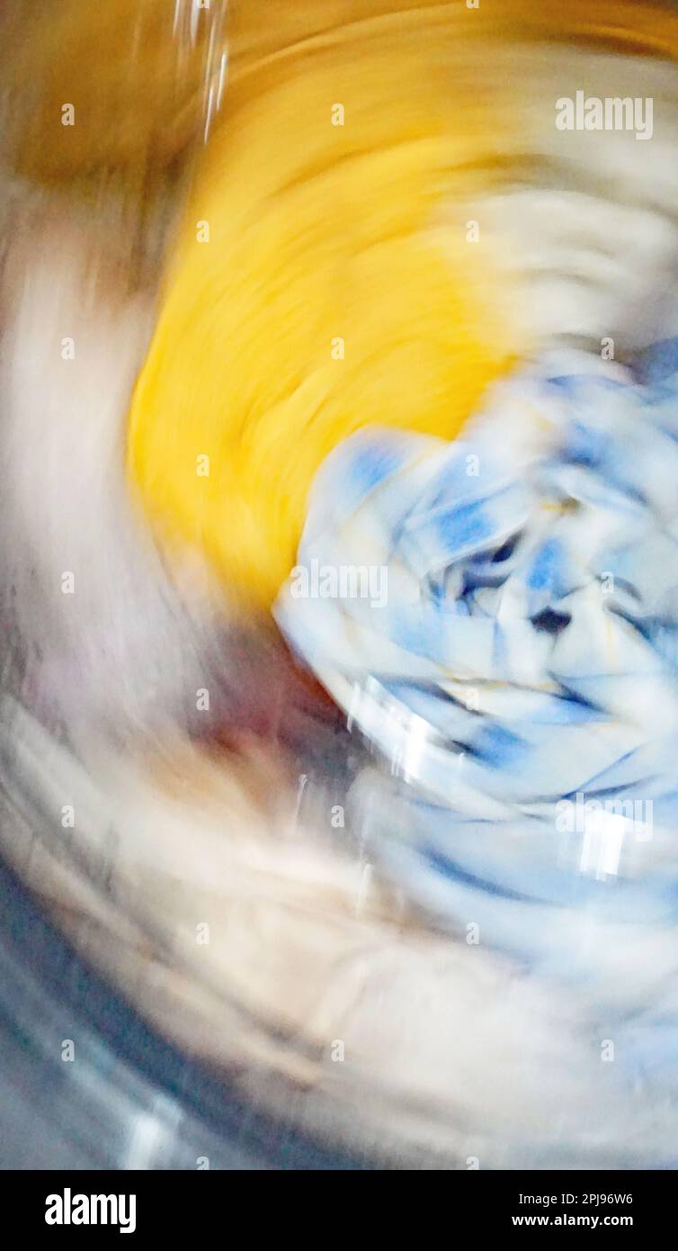 Clothes being washed in a washing machine Stock Photo Alamy