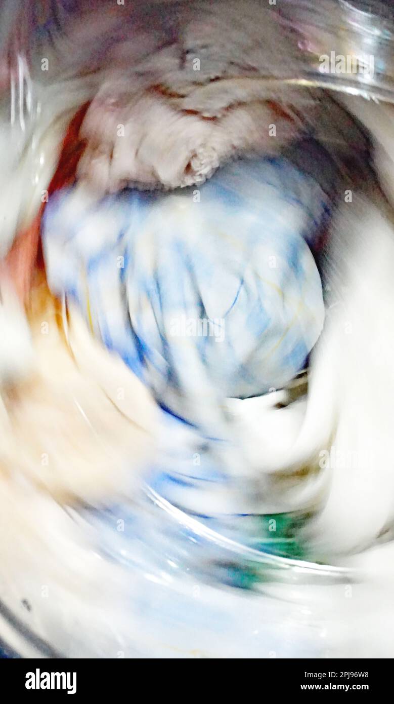 Clothes being washed in a washing machine Stock Photo Alamy