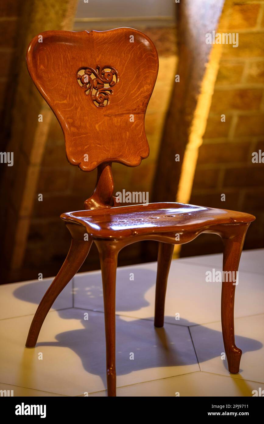 Chair designed by Antoni Gaudí for the Casa Batlló and exhibited in an exhibition inside Casa Milà - La Pedrera (Barcelona, Catalonia, Spain) Stock Photo