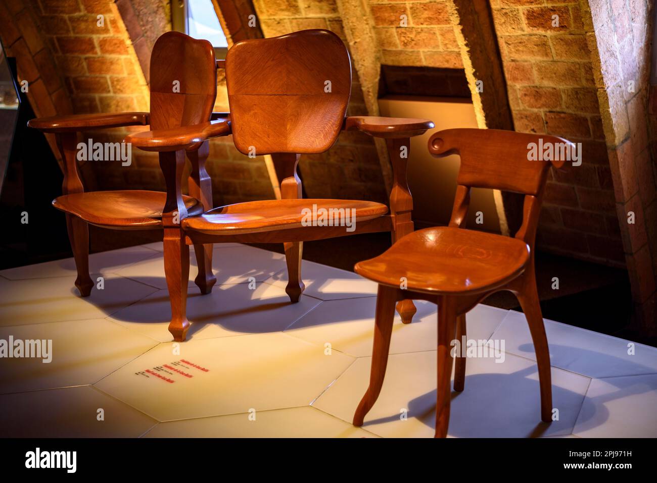 Chair designed by Antoni Gaudí for the Casa Batlló and exhibited in an exhibition inside Casa Milà - La Pedrera (Barcelona, Catalonia, Spain) Stock Photo