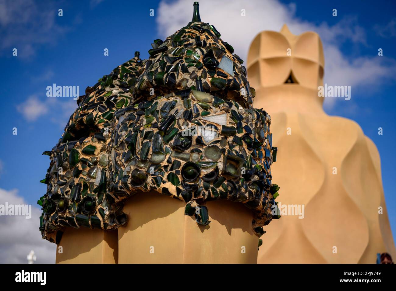 Chimneys in the shape of warrior soldiers on the rooftop terrace of Casa Milà - La Pedrera covered with trencadis made of glass bottles (Barcelona) Stock Photo