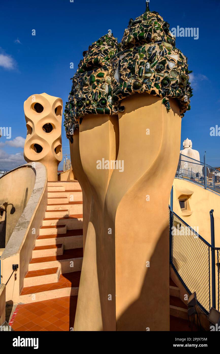 Chimneys in the shape of warrior soldiers on the rooftop terrace of Casa Milà - La Pedrera covered with trencadis made of glass bottles (Barcelona) Stock Photo