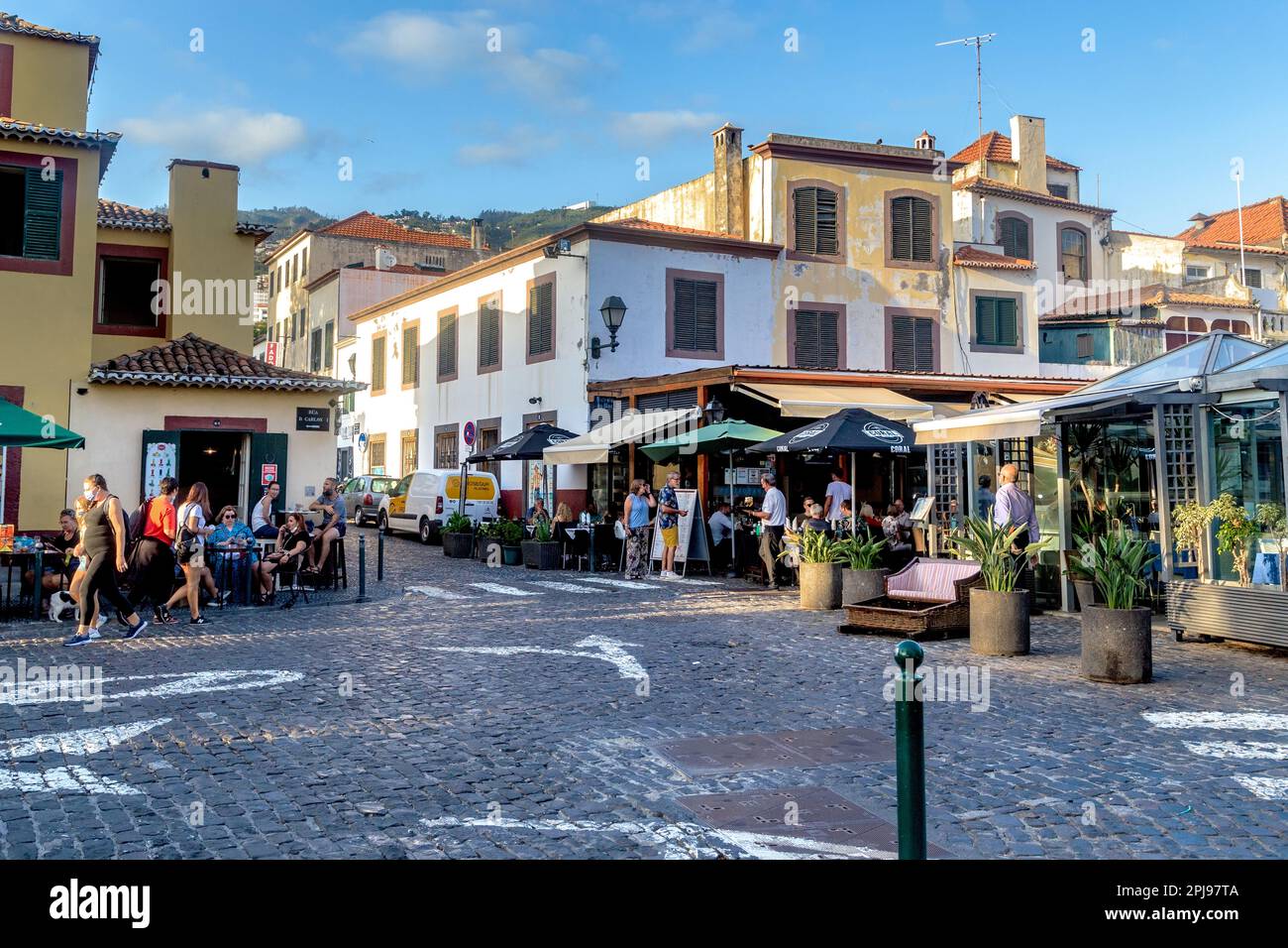 FUNCHAL, PORTUGAL - AUGUST 20, 2021: This is a small square in the old seaside area of the city (Zona Velha) with many small cafes. Stock Photo