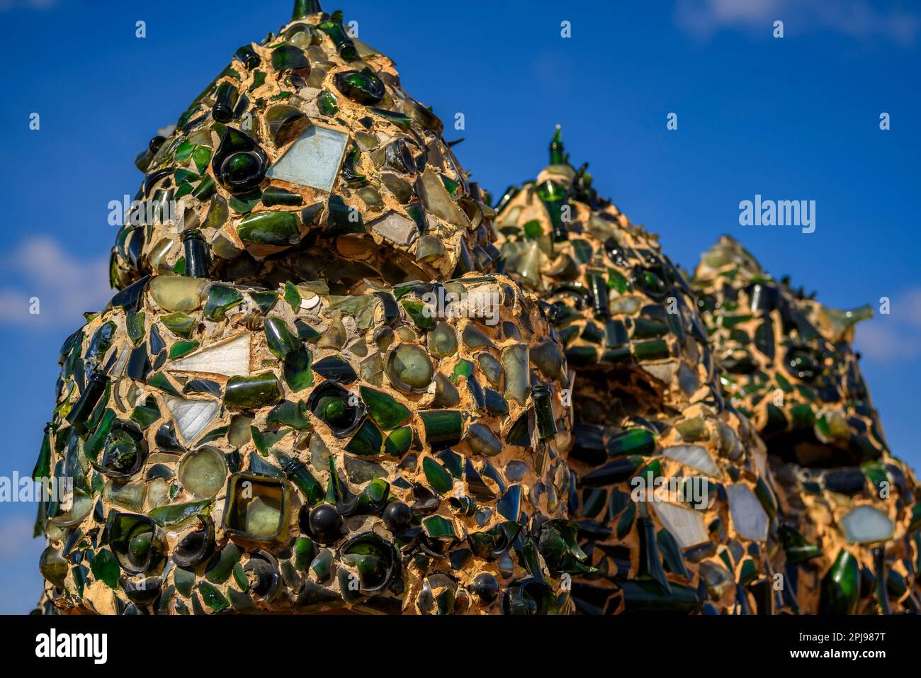 Chimneys in the shape of warrior soldiers on the rooftop terrace of Casa Milà - La Pedrera covered with trencadis made of glass bottles (Barcelona) Stock Photo