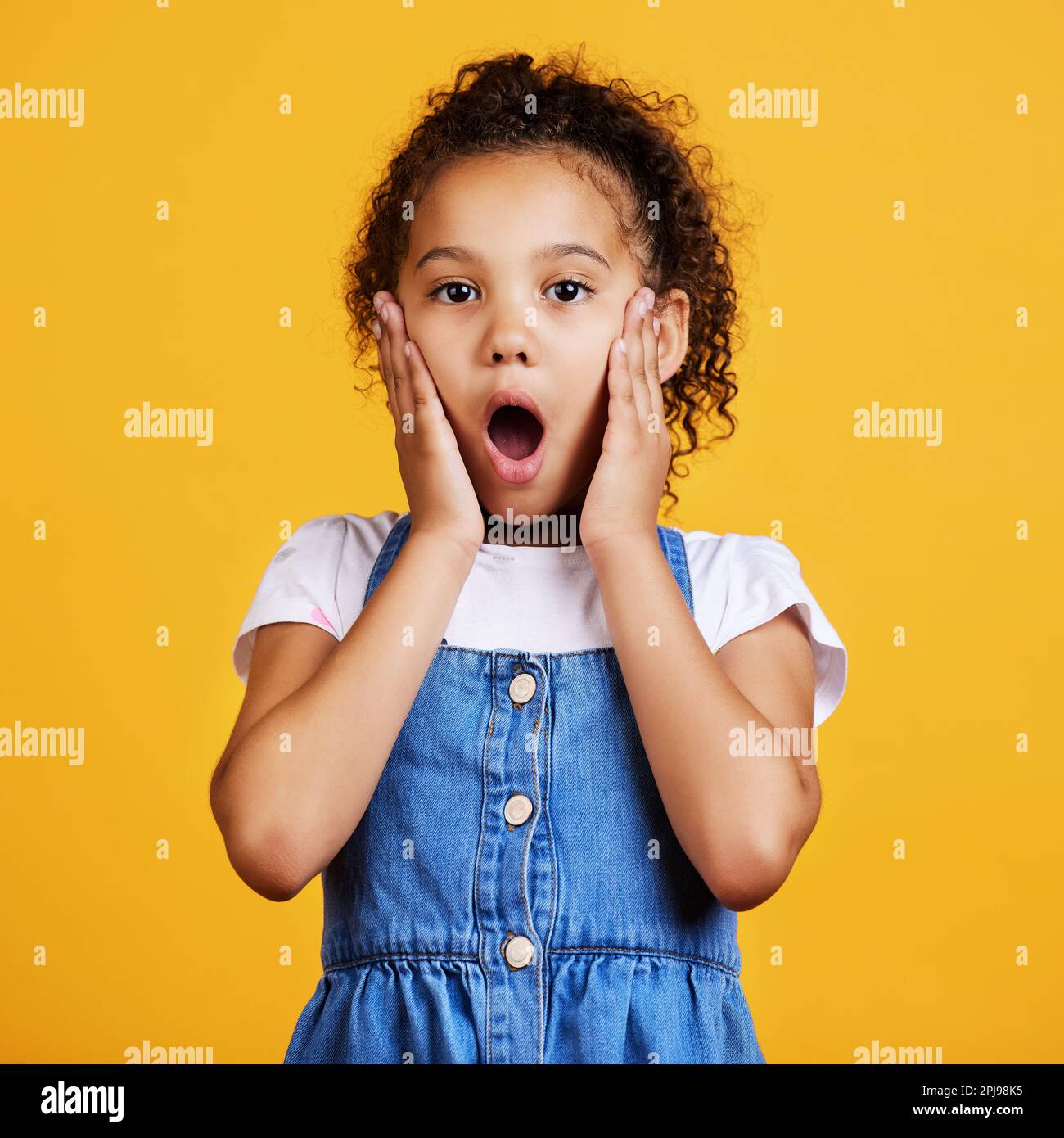 Portrait, wow and girl surprise, shock and kid amazed against a studio