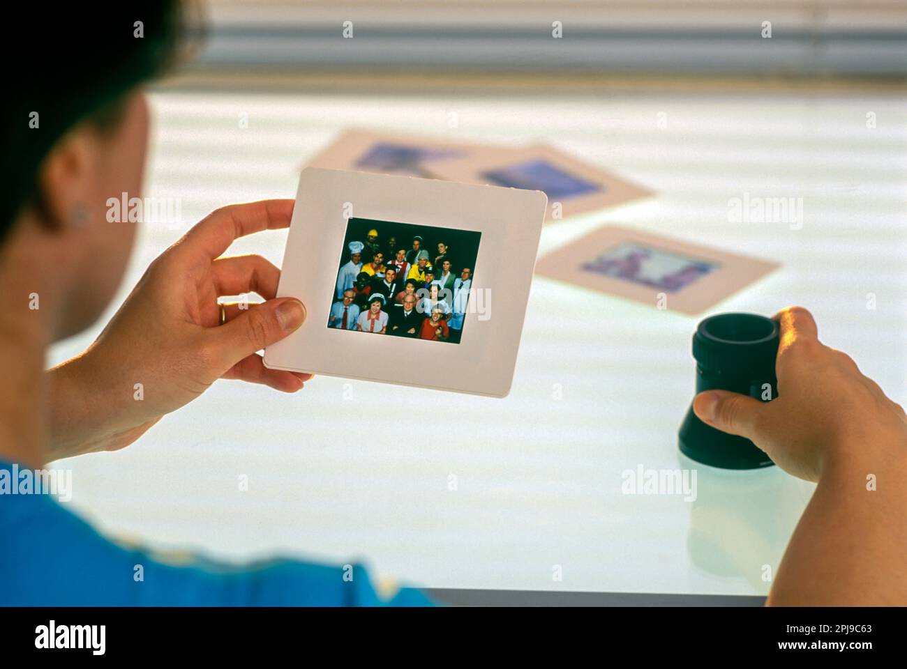 2002 HISTORICAL FEMALE PHOTO EDITOR VIEWING SLIDE TRANSPARENCY FILM ON