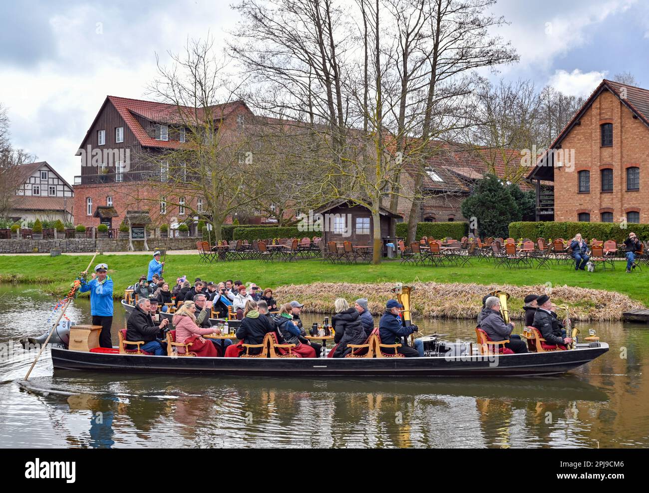 Schlepzig, Germany. 01st Apr, 2023. Brass musicians sit together with other guests on the occasion of this year's season opening in a Spreewald barge at the harbor at the Weidendom in the Spreewald village of Schlepzig. Previously, the pack (wooden pole to move the barge) was ceremoniously handed over to a barge ferryman. At the same time in several places in the Spreewald the traditional season opening with Rudelübergabe took place. Credit: Patrick Pleul/dpa/Alamy Live News Stock Photo