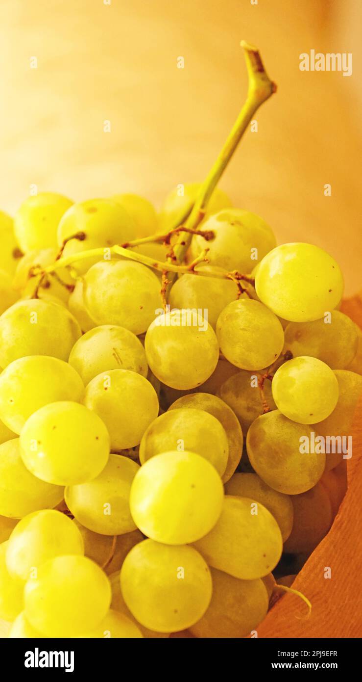 Bunch of white grapes in recyclable paper bag Stock Photo Alamy