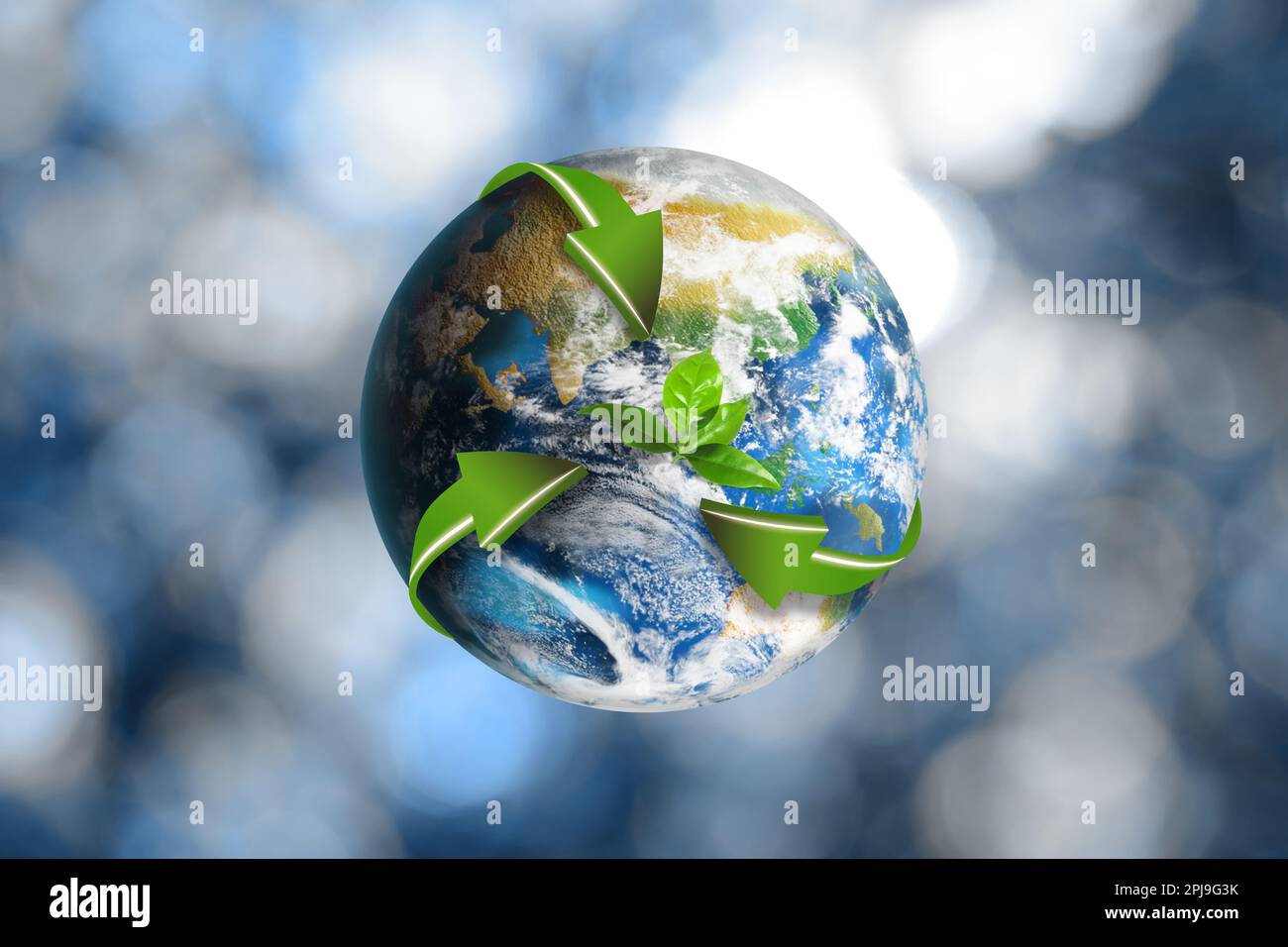Recycling concept. Earth planet with green arrows and leaves on blurred ...