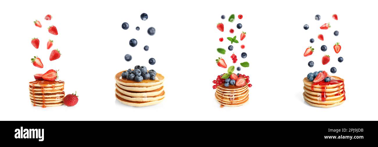 Set of delicious pancakes and different falling berries on white background, banner design Stock Photo