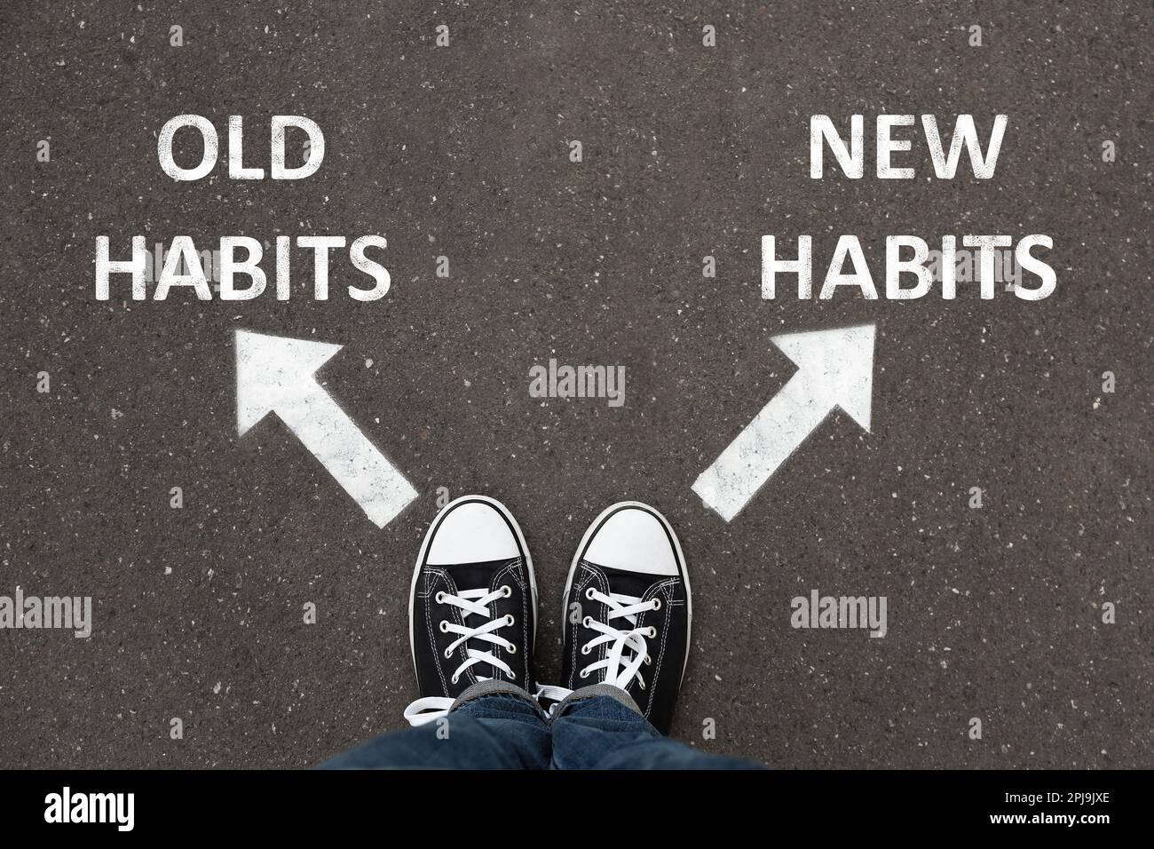 Person standing near arrows with two opposite directions to Old and New