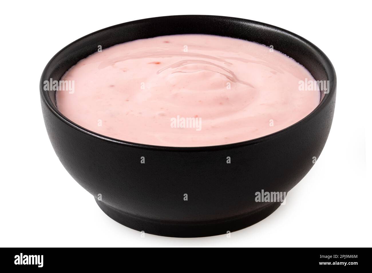 Strawberry yogurt in a black ceramic bowl isolated on white Stock Photo