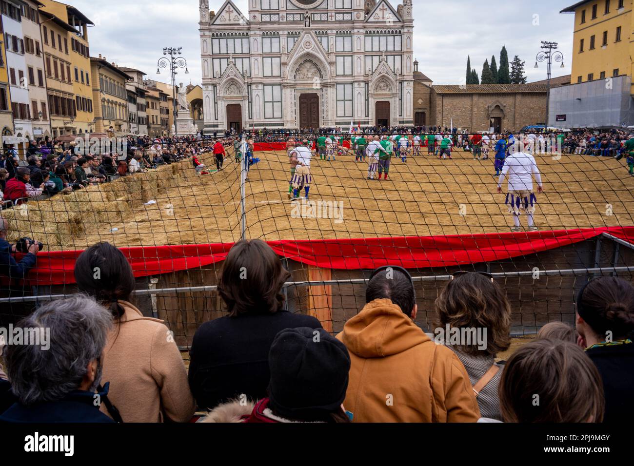 Crowd watches a game of Calcio Fiorentino in Piazza Santa Croce, Florence, Italy Stock Photo