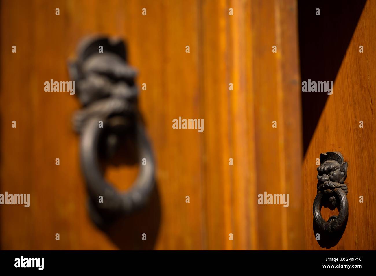 Large door knockers on buildings in Florence, Italy Stock Photo Alamy