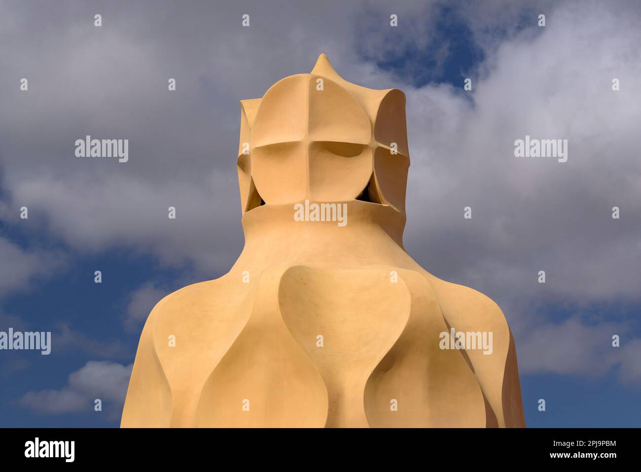 Stairwell topped with curved shapes and the 4-armed cross designed by Gaudí on the roof terrace of Casa Milà - La Pedrera, Barcelona Catalonia Spain Stock Photo