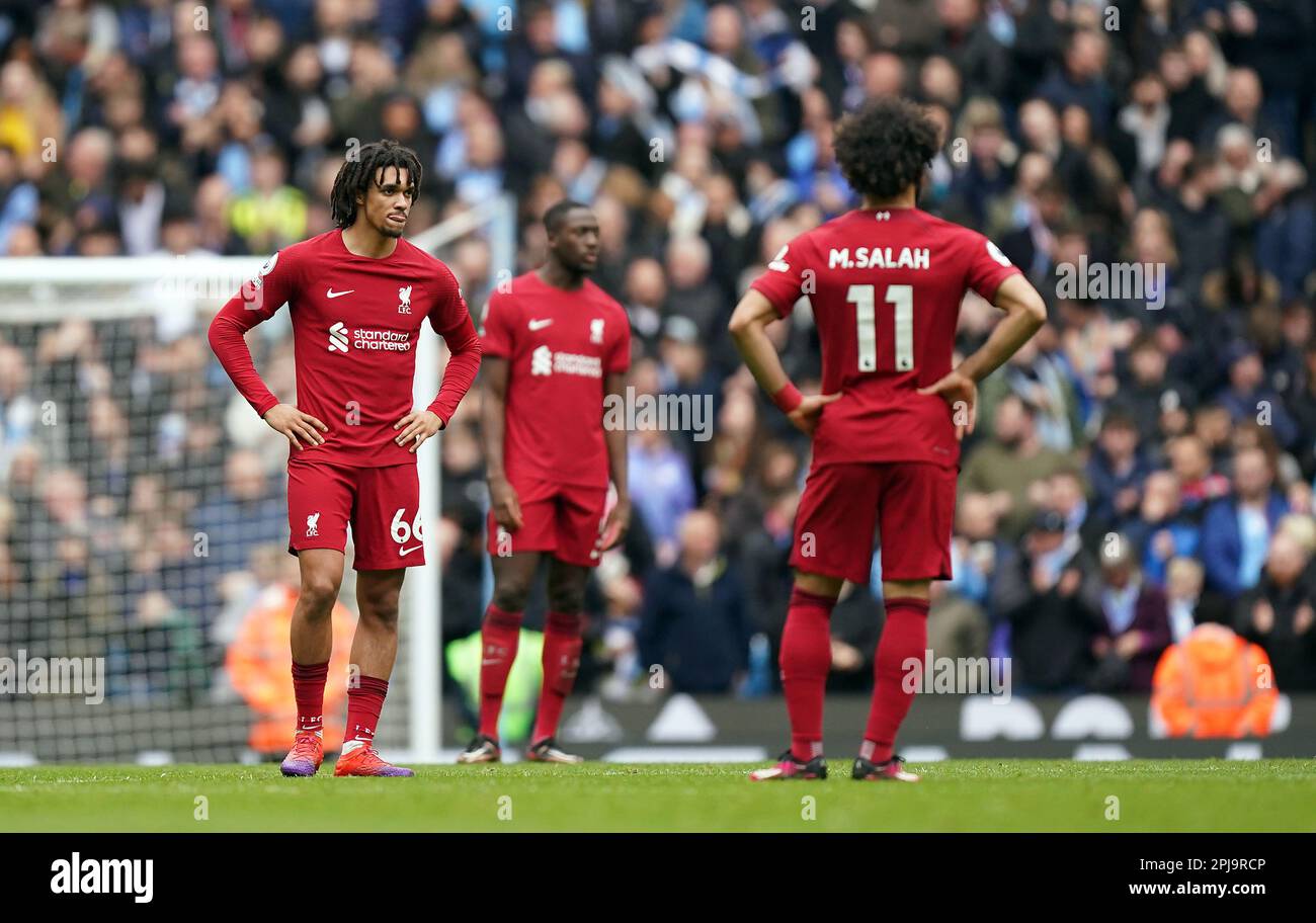 Liverpool's Trent AlexanderArnold and Mohamed Salah appear dejected