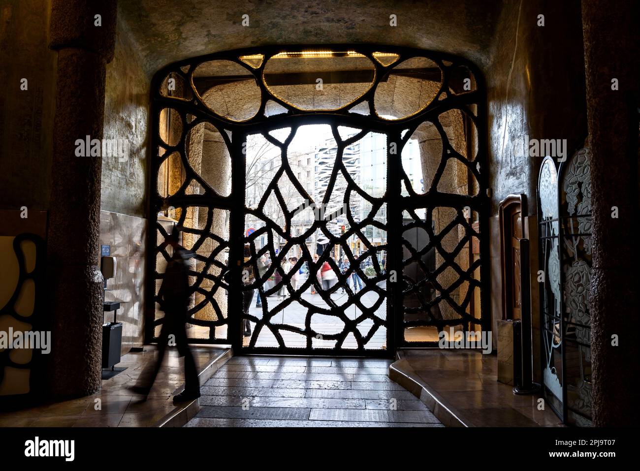 Wrought iron gate at the entrance of Casa Milà (La Pedrera) designed by Antoni Gaudí (Barcelona, Catalonia, Spain) ESP: Puerta de hierro forjado Stock Photo