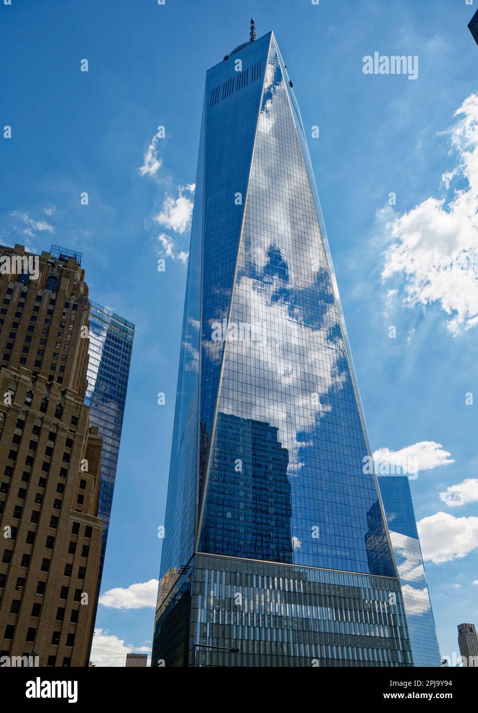 One World Trade Center’s form, a square antiprism, is formed by eight interlocking equilateral triangles of reflective glass. Stock Photo
