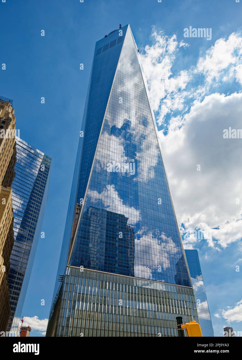 One World Trade Center’s form, a square antiprism, is formed by eight interlocking equilateral triangles of reflective glass. Stock Photo