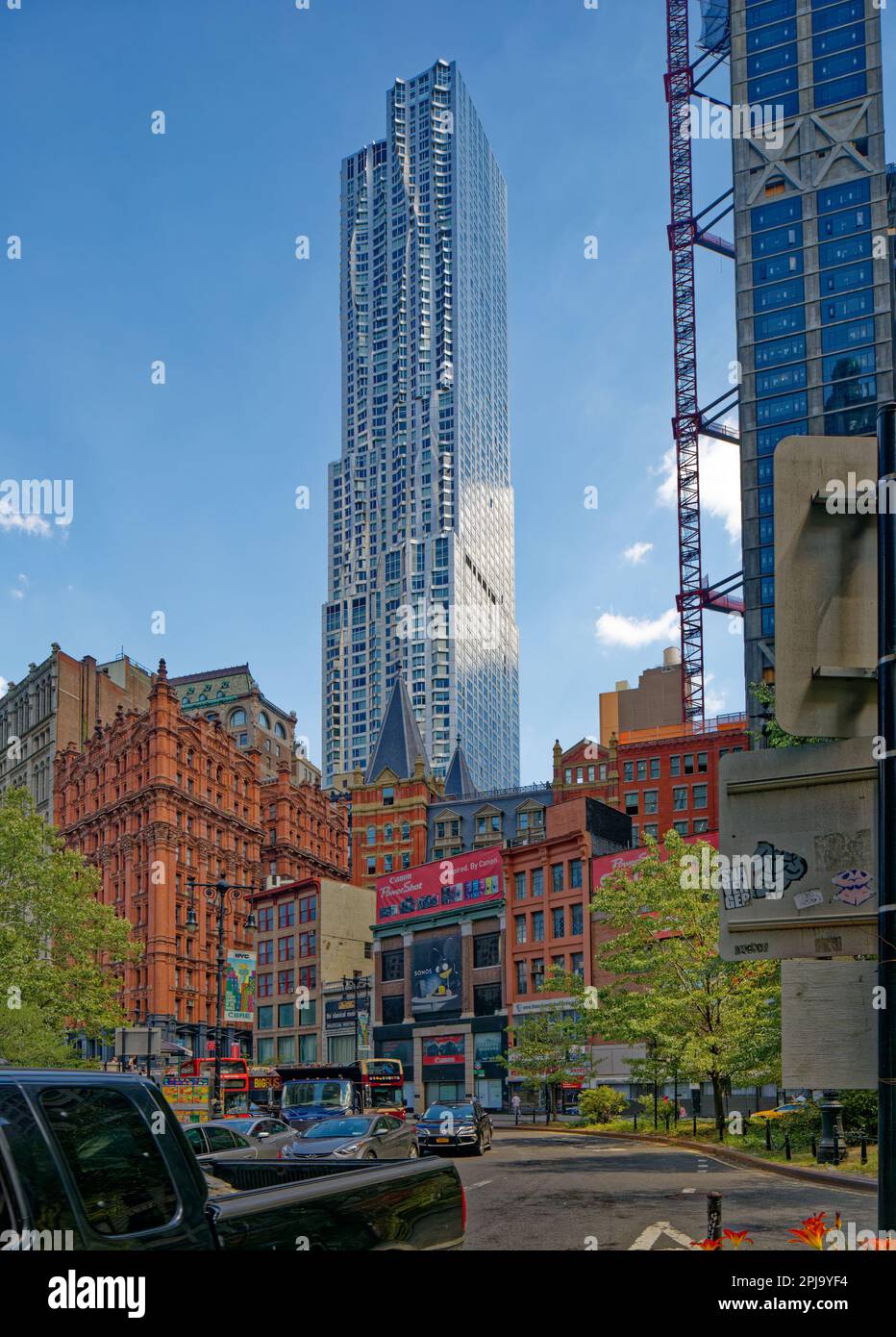 8 Spruce Street, aka New York By Gehry, has an undulating stainless steel curtain wall façade, said to mimic an actual curtain. Stock Photo