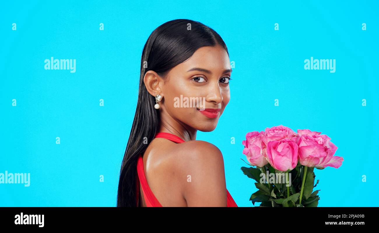 Studio face, flower bouquet and happy woman with beauty nature gift
