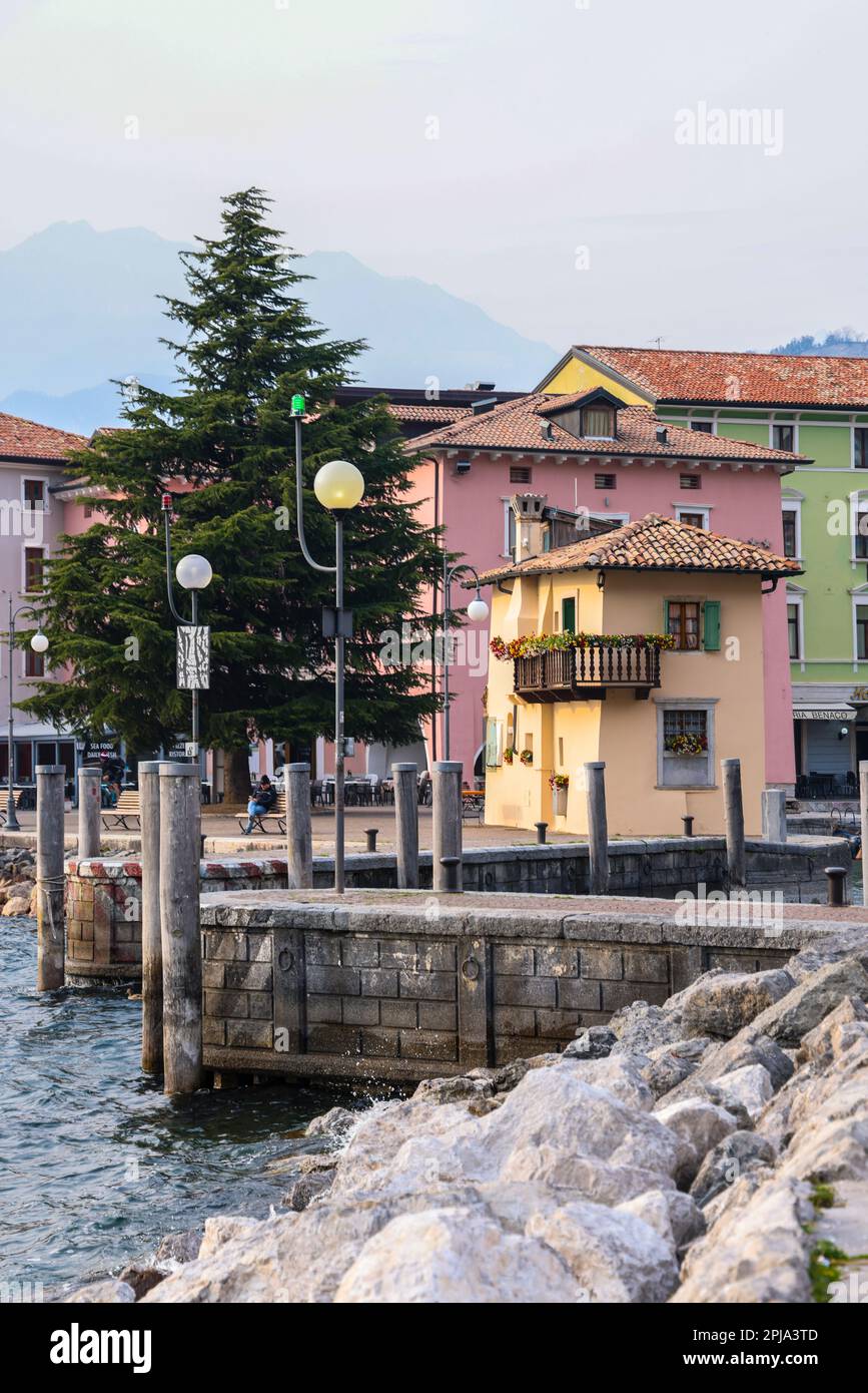 Spring landscape with stone pathway and colorful buildings and ...