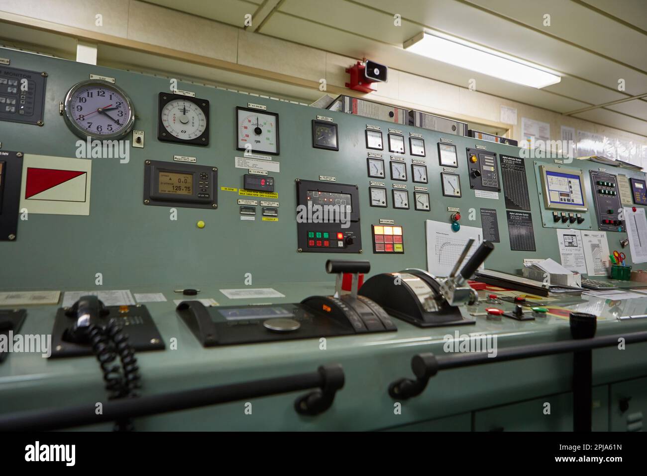 Interior of ship's engine room control compartment. The control