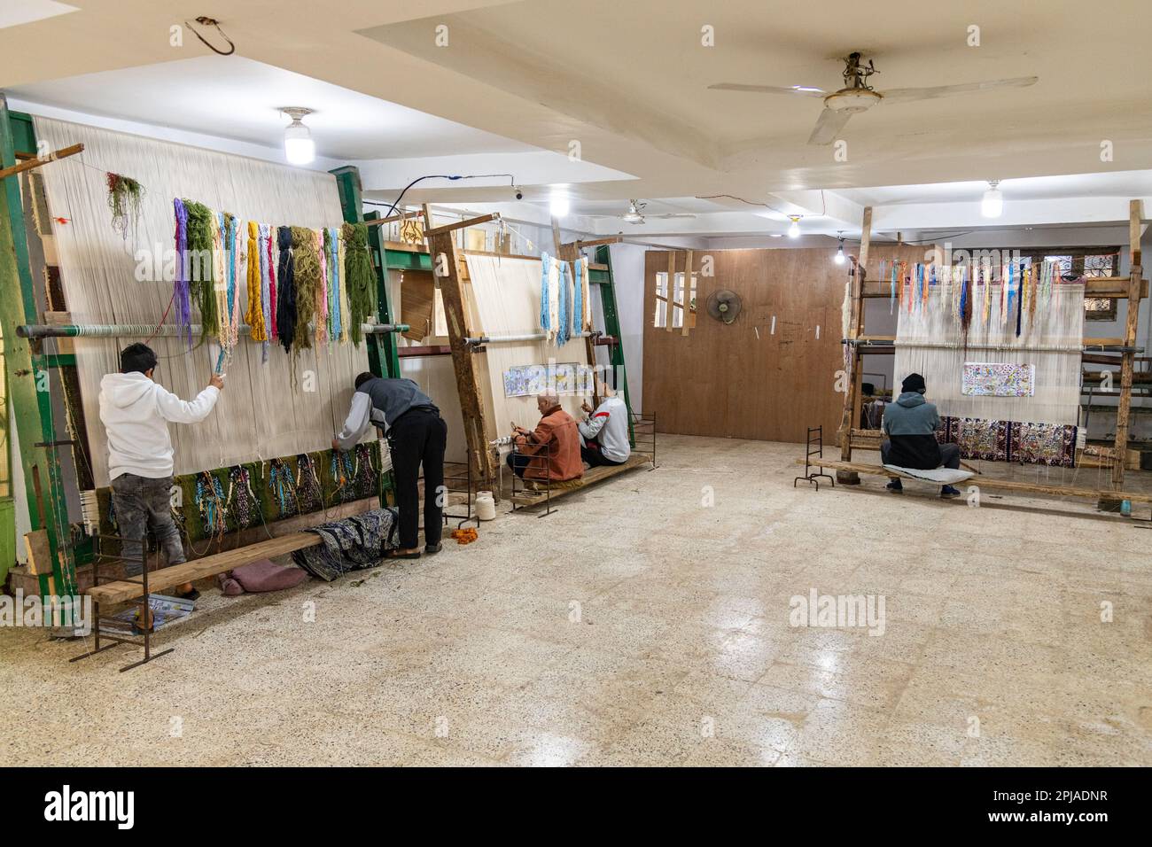 People weaving Egyptian rugs at a factory in Egypt Stock Photo Alamy