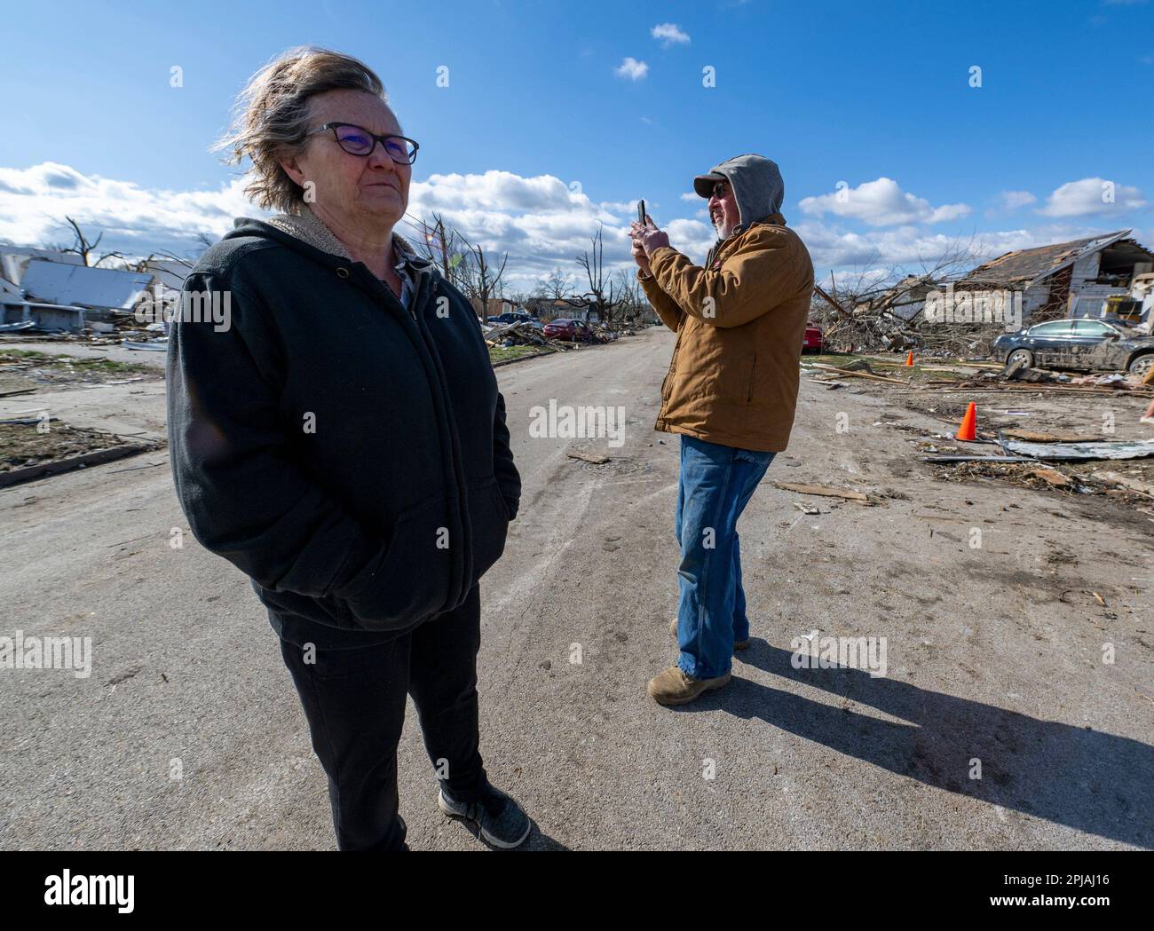 Residents survey the damage from a latenight tornado in Sullivan, Ind