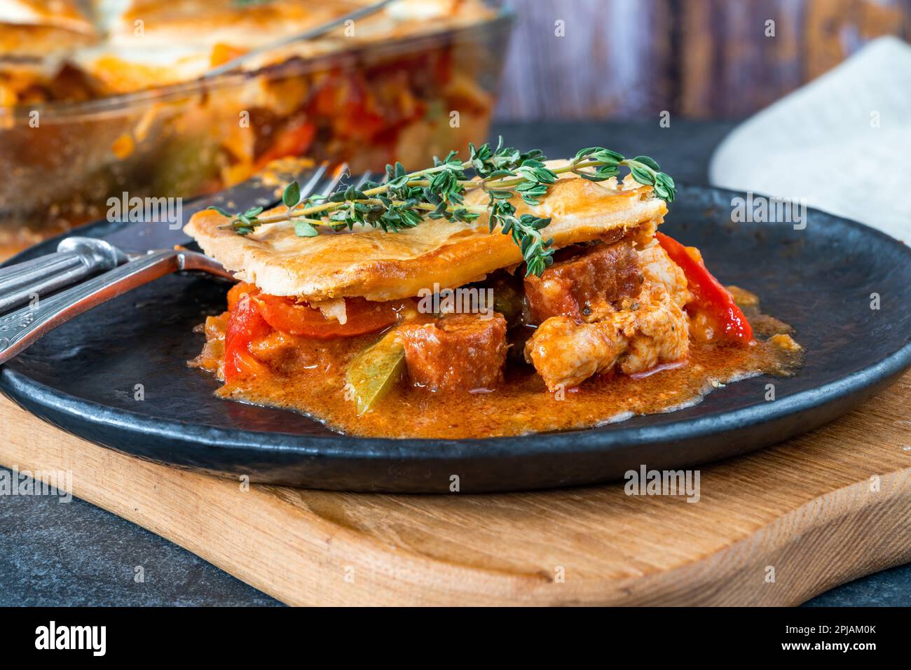 Basque chicken and chorizo pie Stock Photo - Alamy