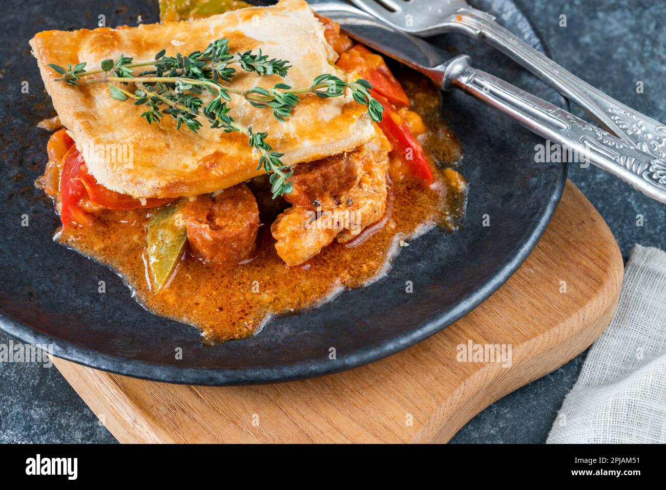 Basque chicken and chorizo pie Stock Photo - Alamy