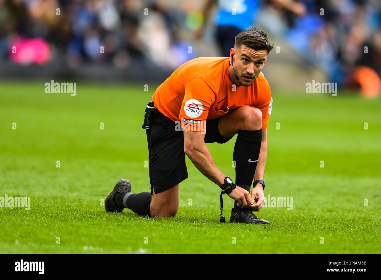 Referee Thomas Kirk (Match referee) ties boot laceduring the Sky Bet League 1 match between Peterborough and Oxford United at London Road, Peterborough on Saturday 1st April 2023. (Photo: Kevin Hodgson | MI News) Credit: MI News & Sport /Alamy Live News Stock Photo