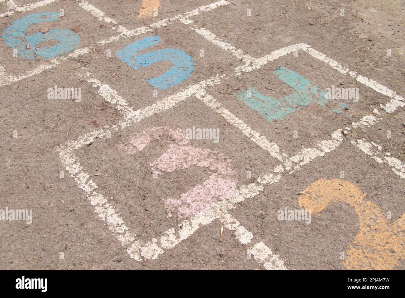 children's game on the asphalt, numbers are painted on the asphalt with