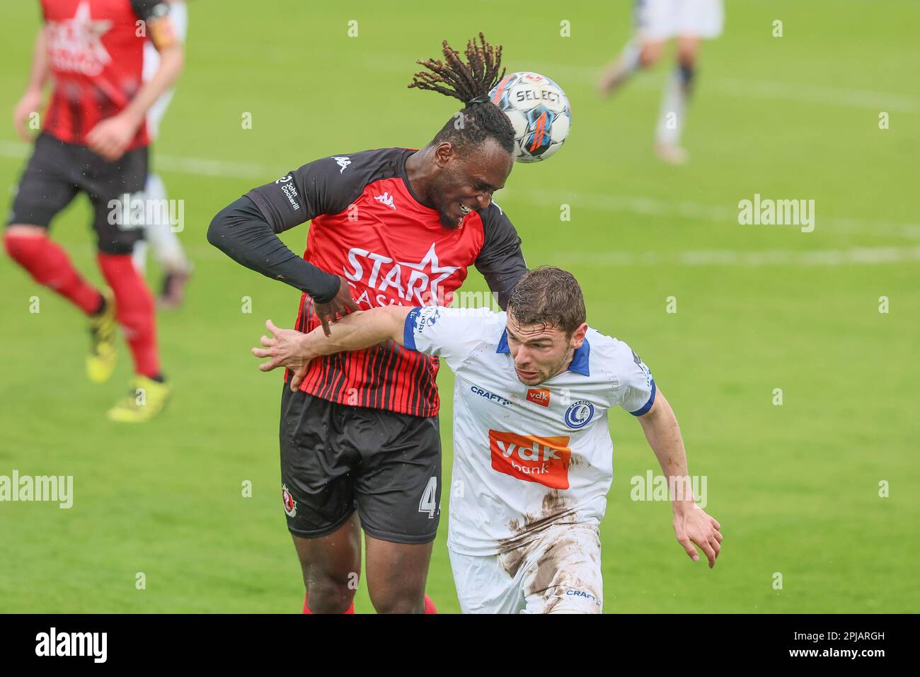 Seraing, Belgium. 01st Apr, 2023. Seraing's Marvin Silver Tshibuabua and Gent's Hugo Cuypers fight for the ball during a soccer match between RFC Seraing and KAA Gent, Saturday 01 April 2023 in Seraing, on day 31 of the 2022-2023 'Jupiler Pro League' first division of the Belgian championship. BELGA PHOTO BRUNO FAHY Credit: Belga News Agency/Alamy Live News Stock Photo