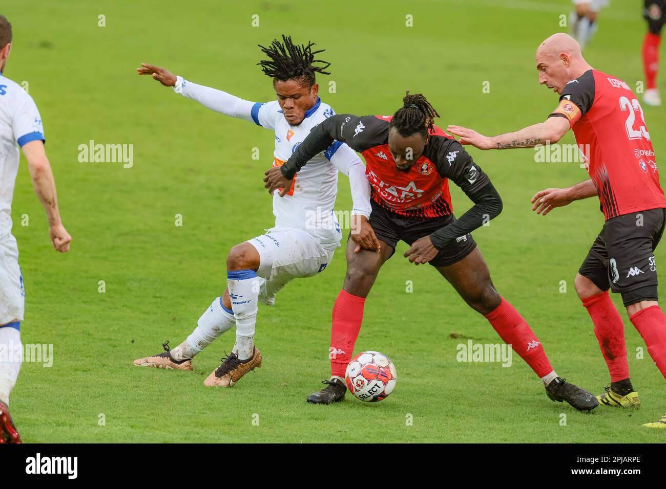 Seraing, Belgium. 01st Apr, 2023. Gent's Gift Emmanuel Orban, Seraing's Marvin Silver Tshibuabua and Seraing's Christophe Lepoint fight for the ball during a soccer match between RFC Seraing and KAA Gent, Saturday 01 April 2023 in Seraing, on day 31 of the 2022-2023 'Jupiler Pro League' first division of the Belgian championship. BELGA PHOTO BRUNO FAHY Credit: Belga News Agency/Alamy Live News Stock Photo
