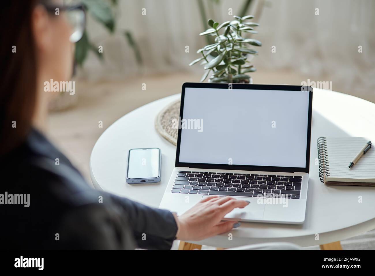 Mockup white screen laptop and mobile phone woman using computer ...