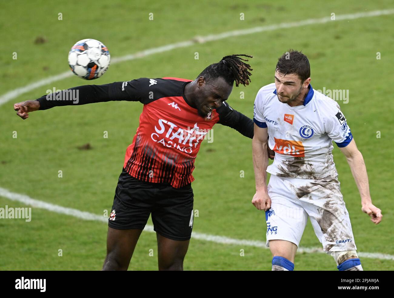 Seraing, Belgium. 01st Apr, 2023. Seraing's Marvin Silver Tshibuabua and Gent's Hugo Cuypers fight for the ball during a soccer match between RFC Seraing and KAA Gent, Saturday 01 April 2023 in Seraing, on day 31 of the 2022-2023 'Jupiler Pro League' first division of the Belgian championship. BELGA PHOTO JOHN THYS Credit: Belga News Agency/Alamy Live News Stock Photo